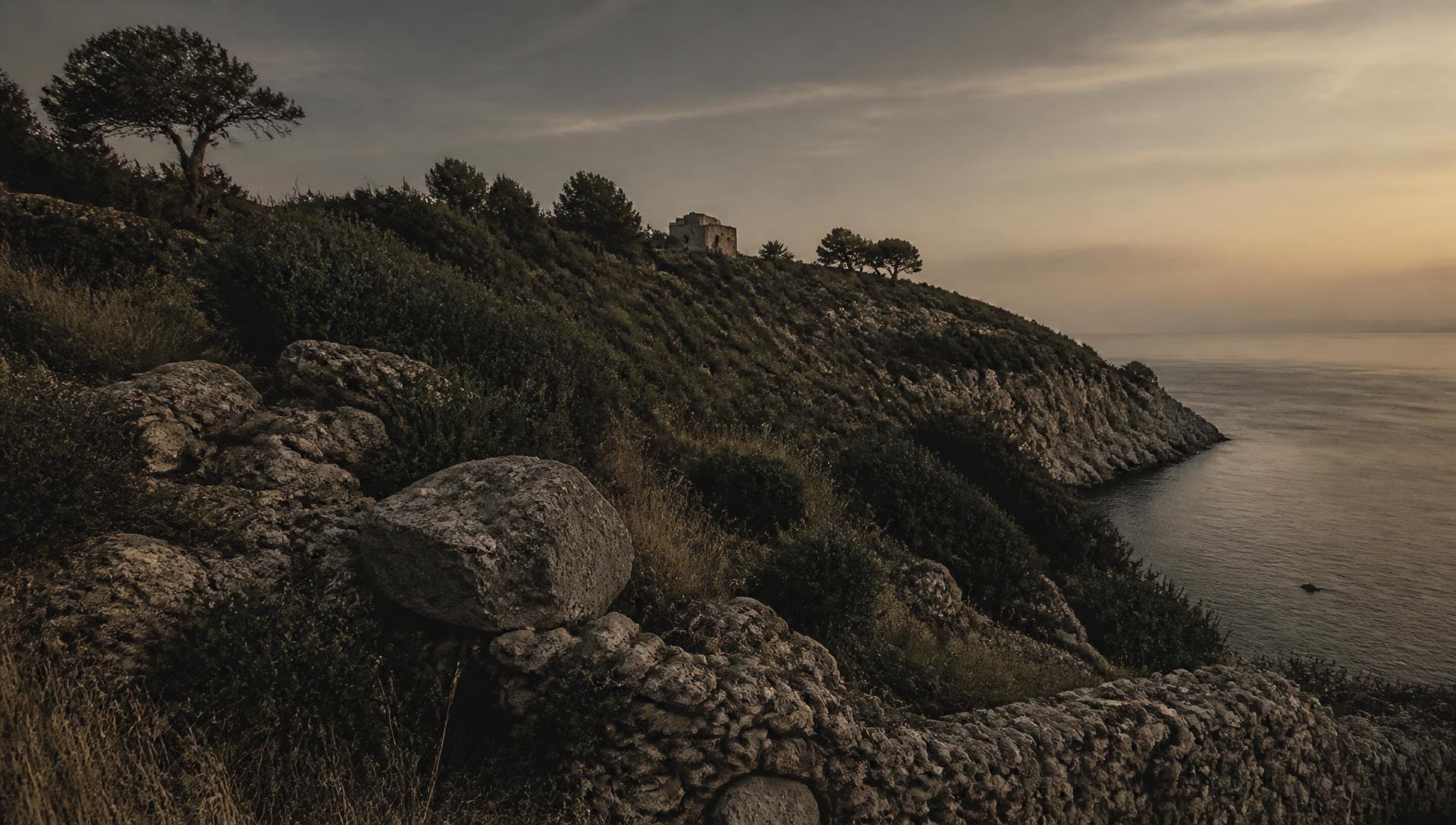 Mediterranean coastal hillside at dusk