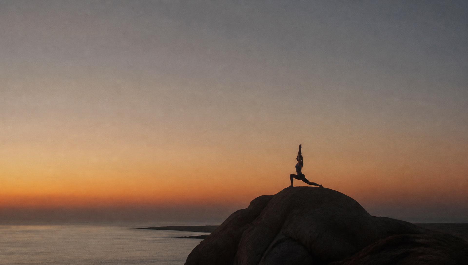 A guest walking a coastal path at first light